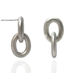 Silver Earrings - Sleek, linked ovals bring movement to these contemporary sterling silver drop earrings. Available in matte or blackened oxidized finish. Though solid, these earrings are not heavy.  They are great for daily wear.  Sterling silver post.<br><br>Dimensions: 3mm thick rings, 1L Silver Oval Link Metal Jewelry, Silver Oval Link Jewelry With Oxidized Finish, Oval Sterling Silver Earrings With Polished Finish, Unique Oval Nickel-free Earrings, Oval Sterling Silver Clip-on Earrings, Thick Ring, Link Earrings, Sterling Silver Drop Earrings, Silver Drop Earrings