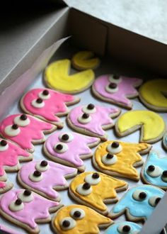 a box filled with lots of decorated cookies