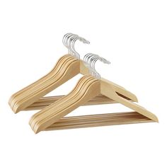 three wooden clothes hangers on a white background