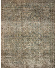 an area rug with various colors and patterns on the carpet, including blue, green, beige