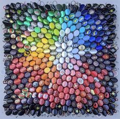 a multicolored art piece made out of buttons