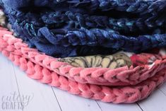 several different colored pieces of yarn stacked on top of each other