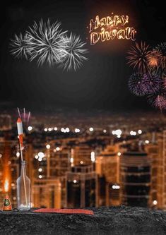 fireworks are lit up in the night sky above a cityscape with buildings and lights