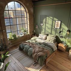 a bedroom with green walls and wooden floors