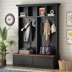 an entryway with a bench and coat rack