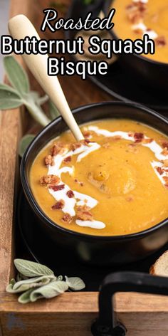 roasted butternut squash bisque in a black bowl