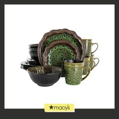 a green and black dinnerware set with matching dishes