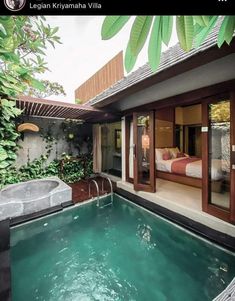 an indoor swimming pool in the middle of a house