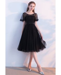 Buy modest illusion round neck black homecoming dress knee length with sleeves at wholesale price online. Free shipping and pro custom service since 2009. Modest Homecoming Dresses 2022, Modest Unique Homecoming Dresses, Black Prom Dresses Mid Calf, Cute Prom Dresses Long Knee Length, Mid Length Black Dress For Wedding, Winter Ball Dresses Short Modest, Cute Prom Dresses Short Modest, Cute Short Dresses Casual Round Neck, Cheap Black Half Sleeve Dresses