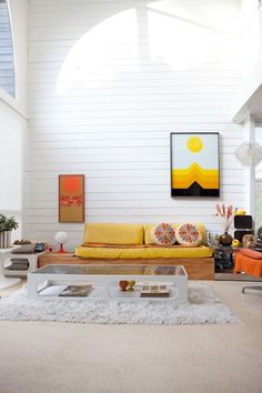 a living room filled with furniture and white walls