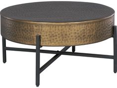 a round coffee table with metal legs