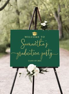 a green sign with white flowers on it that says, welcome to santa martha's graduation party class of 2013