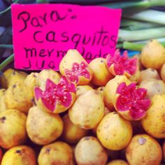 there are many different types of fruit for sale in this market place, and the price is $ 3 each