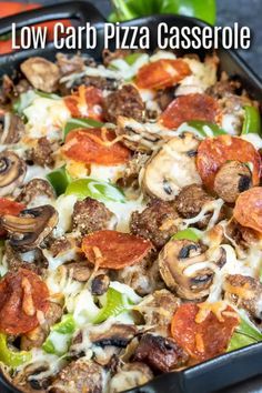 a close up of a pizza in a casserole dish with mushrooms and peppers