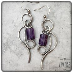 "The jewelry is delivered by Fedex, the delivery time is 3-4 working days! I bent these earrings from stainless steel wire. The wire type is 316L surgical metal wire. I decorated it with a 10 mm amethyste gemstone beads. The lever back closure is stainless steel, but not 316L. The high-gloss steel wire I use is a great alternative to silver wire.  It has a deeper gray color than silver.  However, this color is hereditary, does not change.  It does not oxidize, blacken, or discolor.  It gives a very stable jewelry shape.       Parameters: Total height appr.: 6 cm.(2.2\") I will send the jewel in bubble wrap or in a small box. You can find more earrings from me here: https://www.etsy.com/shop/EWirehu?ref=search_shop_redirect&section_id=28201898 Thank you for your visit!" Ear Wire Earrings, Pierced Dangle Earrings With Wire, Unique Nickel-free Wire Earrings, Nickel-free Metal Wrap Earrings As Gift, Nickel Free Metal Wrap Earrings As Gift, Silver Wire Dangle Jewelry, Silver Dangle Wire Jewelry, Silver Dangle Jewelry Made Of Wire, Wire Wrapped Wrap Earrings As A Gift