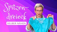 a woman holding up a blue shirt with the words spizen drieck on it