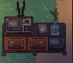 an old fashioned tv set sitting on top of a wooden cabinet next to a plant