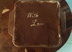 a chocolate cake with the words with love written on it