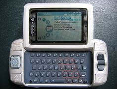 a close up of a cell phone with a keyboard on the front and back side