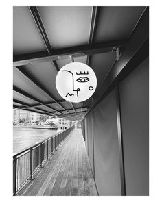 a black and white photo of a walkway with a sign that says, i love you