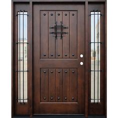 a wooden door with glass panels and wrought iron bars on the top half of it