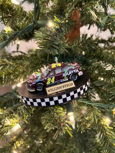 a christmas tree ornament with a racing car on it