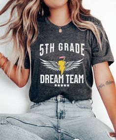 Unite as the Fifth Grade Dream Team with our dynamic shirt, perfect for educators shaping young minds in fifth grade. Showcase your dedication with our 5th Grade Teacher Shirt, tailored specifically for educators in this grade level. Join the teacher squad with our 5th Grade Teacher Tee, fostering a sense of unity and camaraderie among educators. Product Description: ⇝ Bella and Canvas Brand Shirts ⇝ Unisex Adult Sizing ⇝ Rolled Sleeves in pictures are for styling purposes only ⇝ Props used in p 5th Grade Shirts Teachers, Middle School Tshirt Designs, Fifth Grade Teacher Shirts, Team Teacher Shirts, 5th Grade Shirt Ideas, 5th Grade Teacher Shirts, 4th Grade Teacher Shirts, 5th Grade Shirt, Third Grade Teacher Shirts