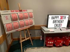 a birthday card display with red dices in front of it