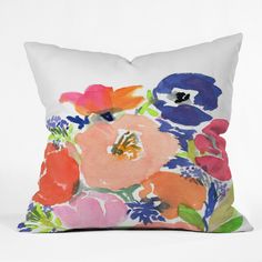 a white pillow with colorful flowers on it