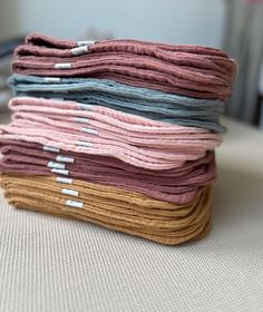 a stack of folded fabric sitting on top of a table