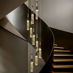 a spiral staircase with lights hanging from it