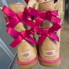 Brand New Pink Bow Tie Holographic Ugg Boots. Size 6. Rare And Extremely Hard To Find. Boot Size Is In Kids. So This Size 6 Boot Will Fit A Woman’s Size 7 Or 8 Uggs Boots With Bows, Cute Ugg Boots, Fye Shoes, Bow Uggs, Pink Ugg Boots, Birthday Shoes, Cute Uggs, Pretty Boots, Nike Collection