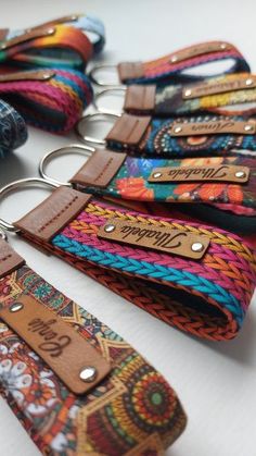 several key chains with leather tags attached to them