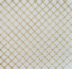 a close up view of a gold colored wire mesh