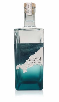 a bottle of land and ocean gin on a white background