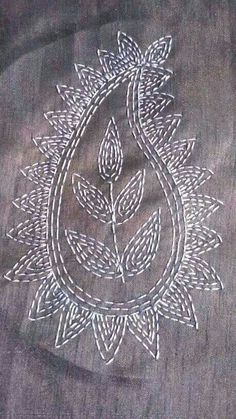 an embroidered design on a piece of cloth