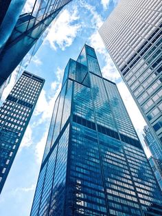 looking up at tall skyscrapers in the city