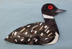 a paper cut out of a duck with red eyes