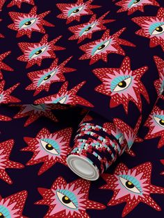 an image of red and blue pattern with eyeballs on black background, wrapping paper