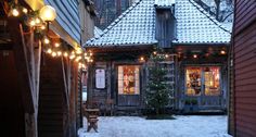 an old house with christmas lights on the outside