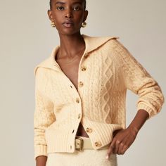 Collared cable-knit cardigan sweater Elegant Cable Knit Sweater For Spring, Trendy Long Sleeve Cable Knit Sweater Coat, Chic Fitted Cable Knit Cardigan, Fitted Textured Knit Cardigan, Classic Fitted Cable Knit Cardigan, Fitted Classic Cable Knit Cardigan, Classic Long Sleeve Sweater, Long Sleeve Cable Knit Sweater Coat For Work, Classic Cable Knit Cardigan For Fall