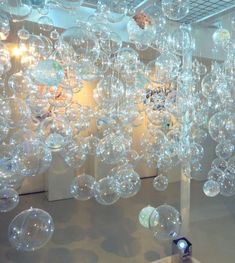 a room filled with lots of bubbles hanging from the ceiling