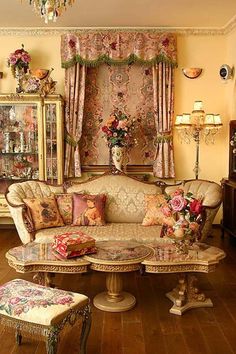 a living room filled with furniture and flowers