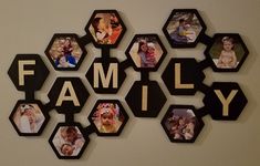 a family photo hanging on the wall with hexagons and photos attached to it