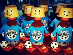 four bottles of soccer syrup with faces on them