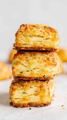 three cheesy biscuits stacked on top of each other