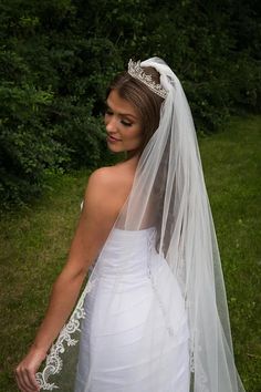 a woman in a wedding dress and veil