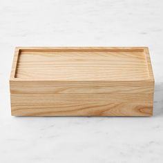 a wooden box sitting on top of a white counter