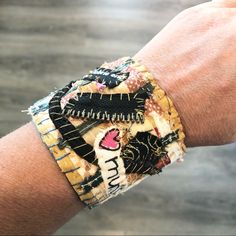 This Bracelet Was Made By My Mom From Fabric Scraps & Other Embellishments. She's Been Sewing Since She Was Young And Now That She's Retired, Exploring Sewing In A More Creative Way, Rather Than Doing It To Make Ends Meet. Approximately 2.5” Wide I Have Approximately A 6.5" Wrist, So You Can See The Fit In The Pictures For A 6.5" Wrist. Fits Up To An 8” Wrist And Is Meant To Fit Loosely So That It Covers Part Of Your Hand. Button & Loop Closure Repurposed Fabric, Handmade Boho Jewelry, Wide Cuff Bracelets, Fiber Jewelry, Wide Cuff, Handmade Boho, Beaded Lace, Fabric Scraps, My Mom