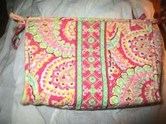 This is a vintage Vera Bradley zip top cosmetic clutch pouch in their Capri Melon  Pink paisley pattern.  It has the green script Vera Bradley interior label, a side loop, side tie, white nylon lining, 3 interior mesh pockets and zip closure pocket with ribbon pull.   The bag is in good condition with minor wear and no other problems to note.  The lining is intact   It measures 7 inches tall, 10 1/2 inches across and is 3 1/2 inches wide. 824 Make Up Case, Pink Paisley, Clutch Pouch, Toiletry Storage, Makeup Case, Paisley Pattern, Cosmetic Bags, Melon, Vera Bradley